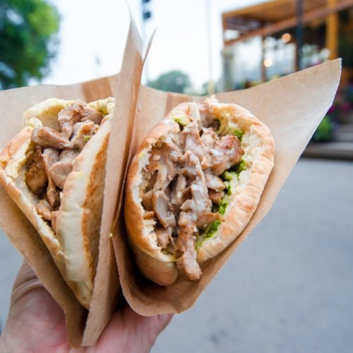 closeup-fast-food-sandwich-on-the-street-outdoors-2025-02-12-00-28-48-utc